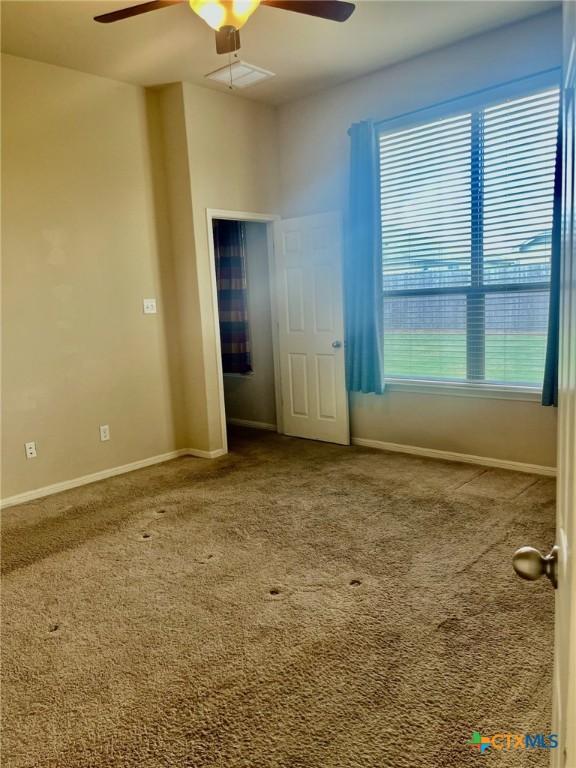 1205 Abbey Rdg, Temple, TX 76504 - carpeted empty room with ceiling fan