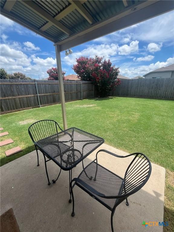 1205 Abbey Rdg, Temple, TX 76504 - fenced backyard with a patio area