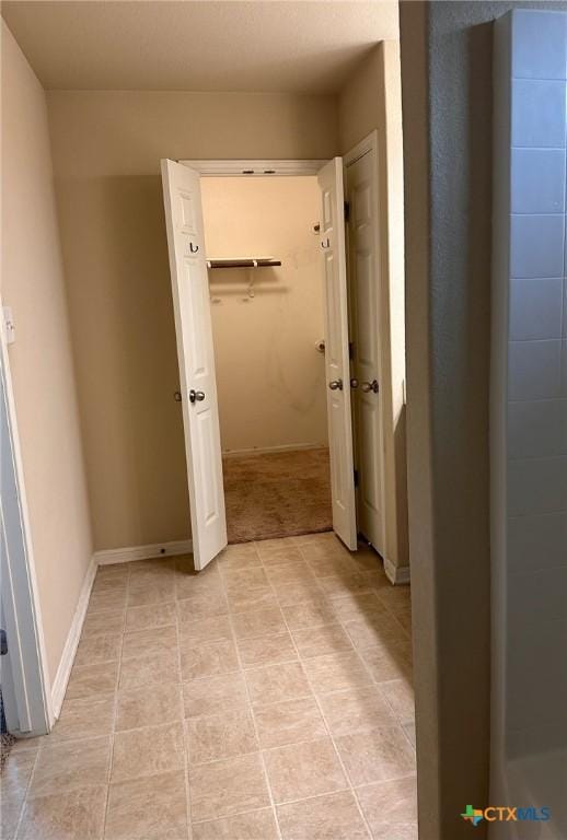 1205 Abbey Rdg, Temple, TX 76504 - hallway featuring baseboards and light tile patterned floors