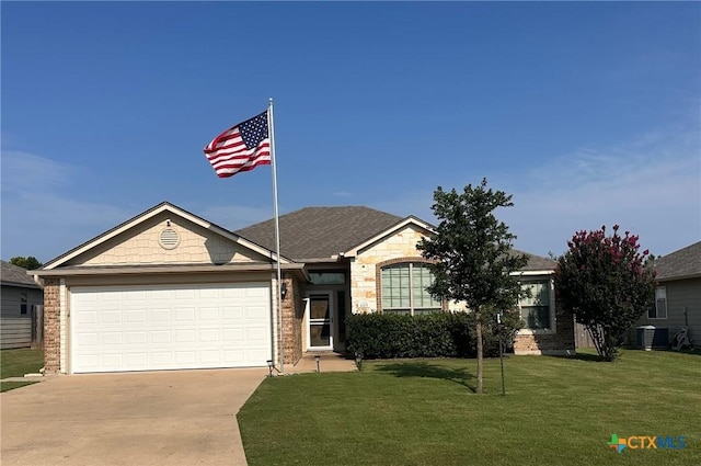 1205 Abbey Rdg, Temple, TX 76504 - view of front of house featuring driveway, an attached garage, a front yard, and brick siding