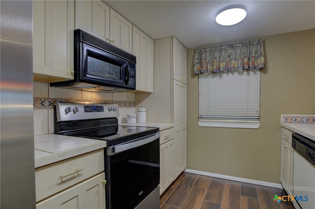 kitchen with white cabinets, stainless steel appliances, and decorative backsplash