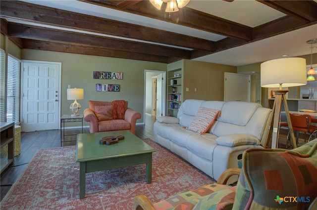 living room with hardwood / wood-style flooring and beam ceiling