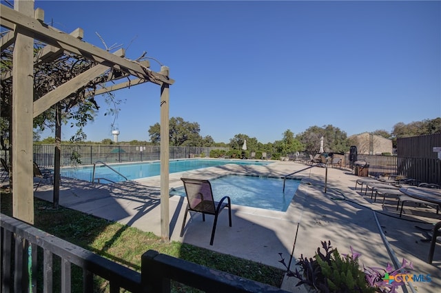 view of pool featuring a patio area and a pergola