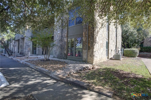 view of front of home featuring cooling unit