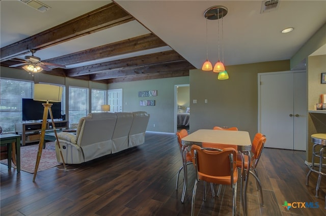 dining area featuring dark hardwood / wood-style floors, beamed ceiling, and ceiling fan