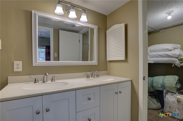 bathroom featuring vanity and a textured ceiling