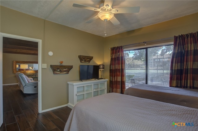 bedroom featuring a textured ceiling and ceiling fan