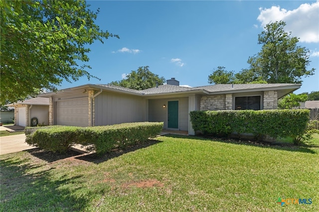 12219 Mosley Ln, Austin, TX 78727 - view of front facade featuring a garage, a chimney, a front yard, stone siding, and concrete driveway