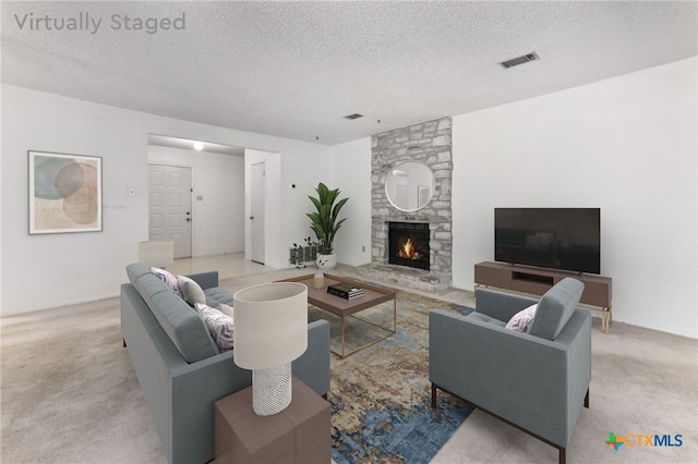 12219 Mosley Ln, Austin, TX 78727 - carpeted living area with a textured ceiling and a stone fireplace