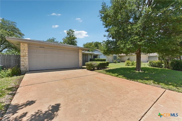 12219 Mosley Ln, Austin, TX 78727 - view of front of home featuring concrete driveway