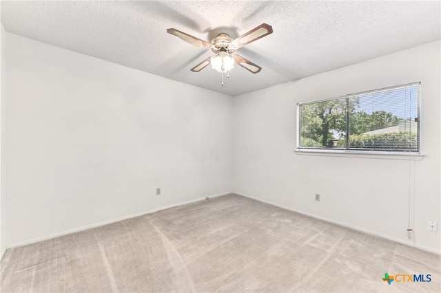 12219 Mosley Ln, Austin, TX 78727 - empty room featuring a ceiling fan, light colored carpet, and a textured ceiling