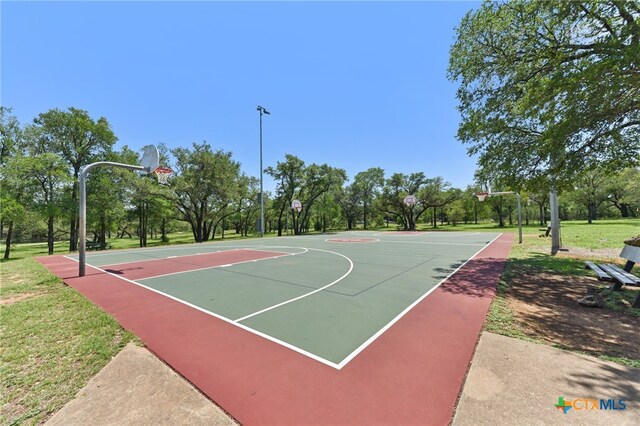 12219 Mosley Ln, Austin, TX 78727 - view of basketball court with community basketball court and view of scattered trees