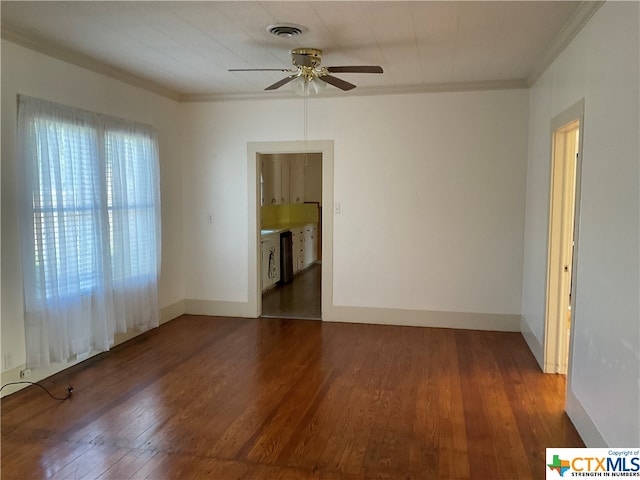 unfurnished room featuring ornamental molding, ceiling fan, and dark hardwood / wood-style floors