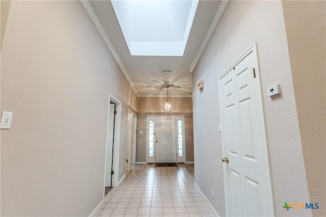 820 California Blvd, New Braunfels, TX 78130 - entrance foyer with a skylight, ornamental molding, light tile patterned floors, and baseboards