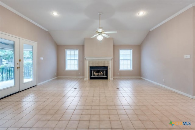 820 California Blvd, New Braunfels, TX 78130 - unfurnished living room with ceiling fan, baseboards, vaulted ceiling, light tile patterned flooring, and a fireplace
