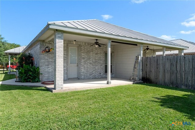 225 Anne Louise Dr, New Braunfels, TX 78130 - view of front of home featuring a ceiling fan, a standing seam roof, brick siding, and a patio area