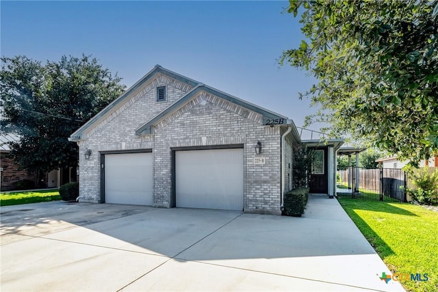 225 Anne Louise Dr, New Braunfels, TX 78130 - ranch-style house with brick siding, concrete driveway, and an attached garage