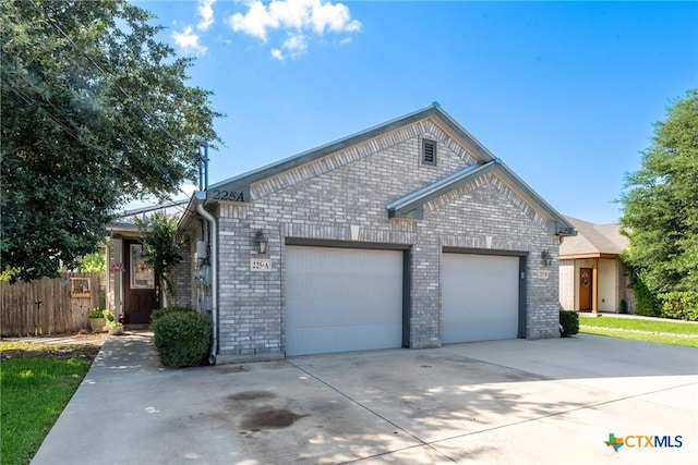 225 Anne Louise Dr, New Braunfels, TX 78130 - ranch-style house featuring driveway, a garage, and brick siding