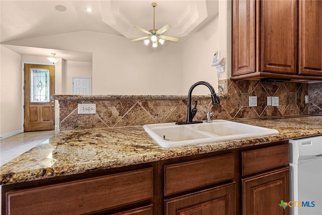 225 Anne Louise Dr, New Braunfels, TX 78130 - kitchen featuring dishwasher, ceiling fan, tasteful backsplash, lofted ceiling, and stone counters