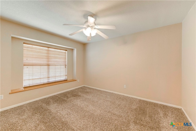 unfurnished room featuring ceiling fan, a textured ceiling, and carpet floors