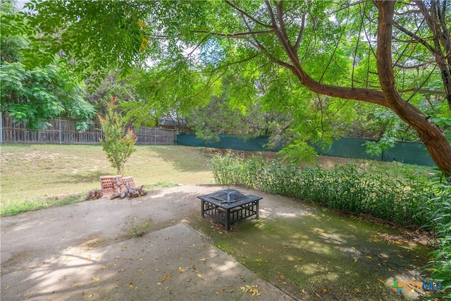 view of patio / terrace with an outdoor fire pit