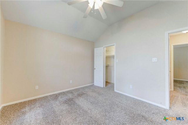 unfurnished bedroom featuring ceiling fan, light carpet, and lofted ceiling