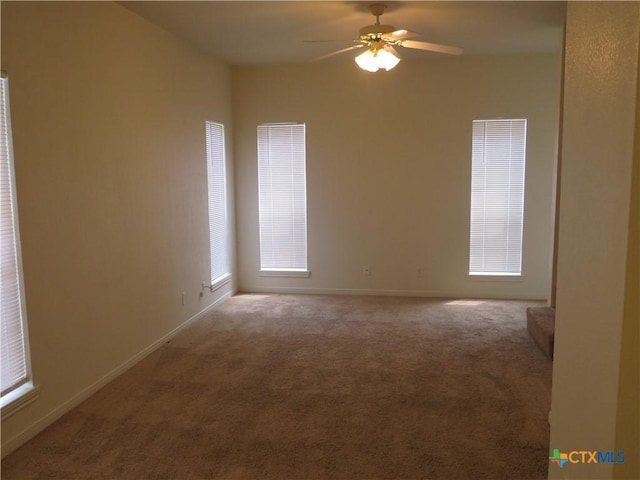 unfurnished room featuring carpet flooring and ceiling fan