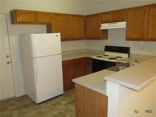 kitchen with white refrigerator, electric stove, sink, and kitchen peninsula