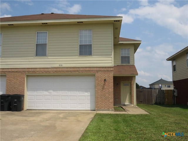 view of front facade with a garage and a front yard