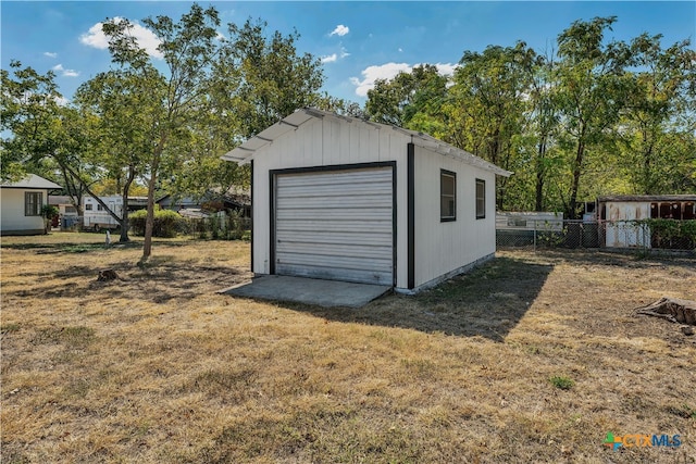 garage with a yard