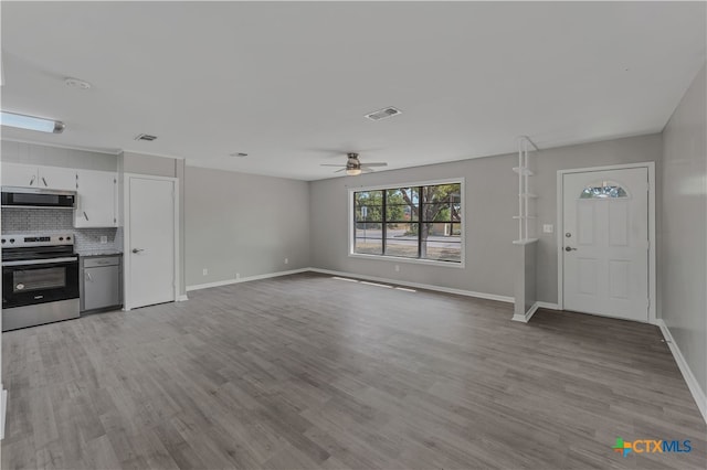 unfurnished living room featuring light hardwood / wood-style floors and ceiling fan