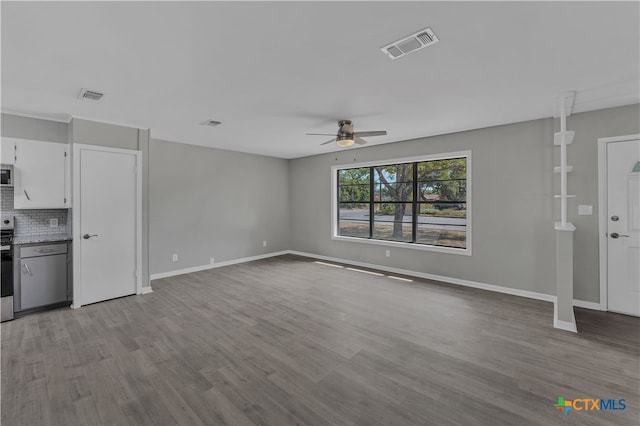 unfurnished living room featuring ceiling fan and light hardwood / wood-style flooring