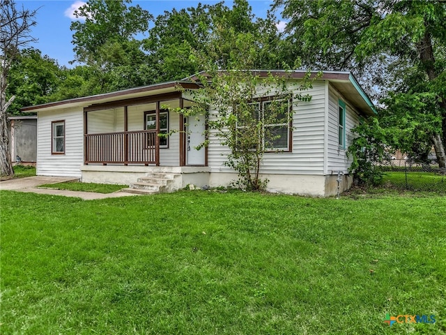 view of front of house with a porch and a front yard