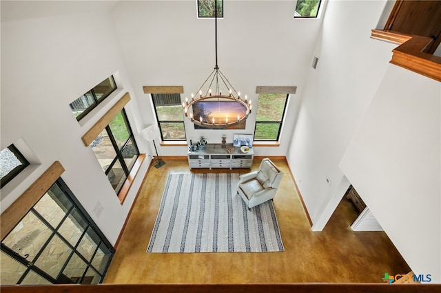 27302 Felswand Pkwy, New Braunfels, TX 78132 - living room with a towering ceiling, baseboards, a chandelier, and plenty of natural light