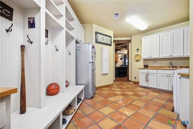 27302 Felswand Pkwy, New Braunfels, TX 78132 - mudroom featuring a sink, light tile patterned floors, and baseboards