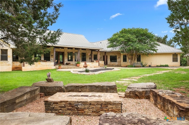 27302 Felswand Pkwy, New Braunfels, TX 78132 - back of property featuring metal roof, a yard, a standing seam roof, and a porch