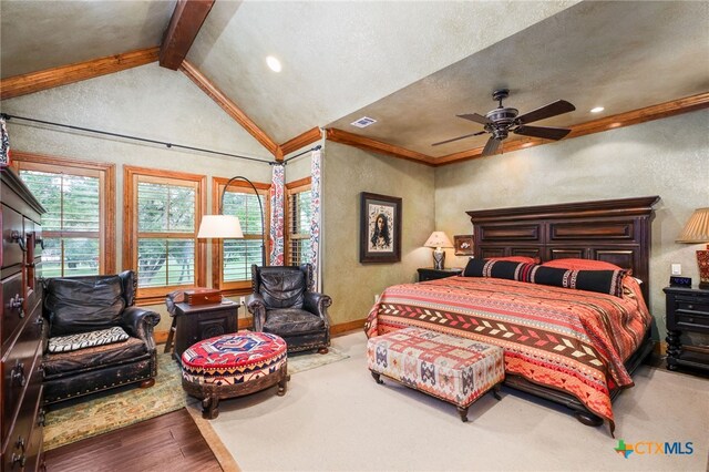 27302 Felswand Pkwy, New Braunfels, TX 78132 - bedroom featuring wood finished floors, multiple windows, ornamental molding, a textured wall, and baseboards