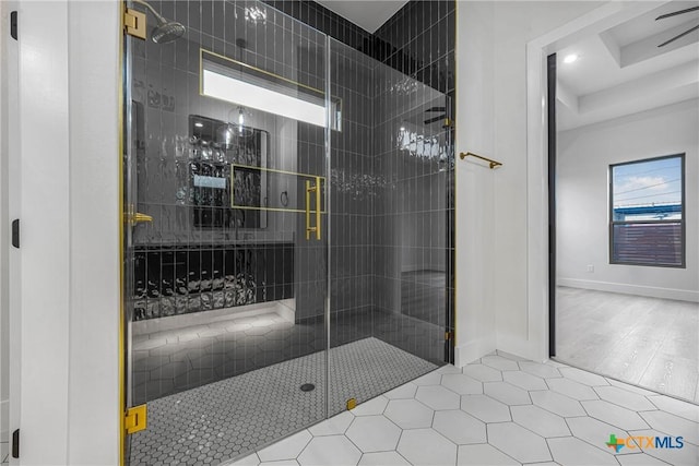 303 W Lane Ave, Manor, TX 78653 - bathroom featuring a stall shower, tile patterned floors, and recessed lighting