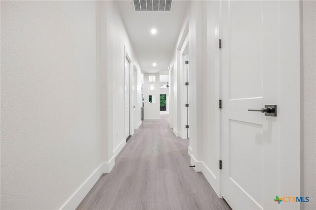 303 W Lane Ave, Manor, TX 78653 - hallway featuring recessed lighting and light wood finished floors