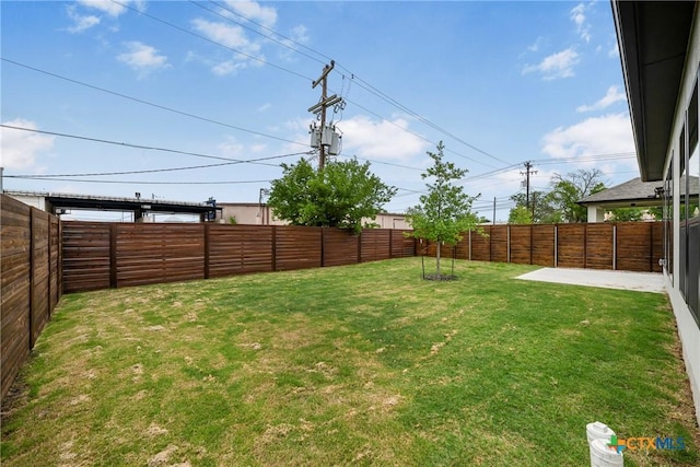 303 W Lane Ave, Manor, TX 78653 - fenced backyard featuring a patio