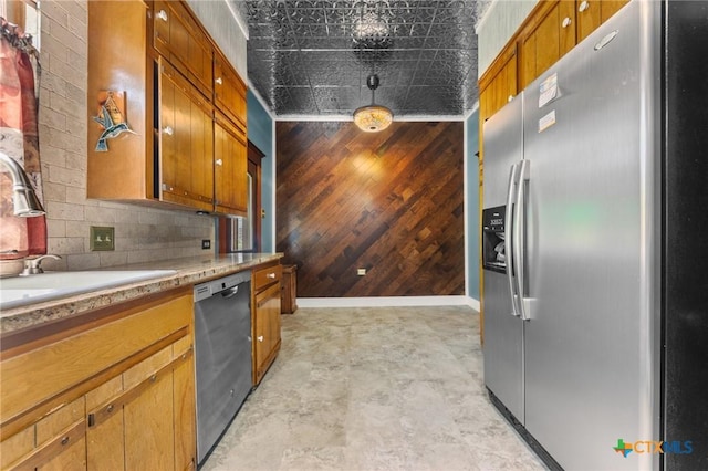 9 S Milam St, Rogers, TX 76569 - kitchen with a sink, dishwashing machine, wooden walls, light countertops, and stainless steel fridge with ice dispenser