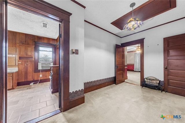 9 S Milam St, Rogers, TX 76569 - corridor featuring visible vents, wood walls, baseboards, light carpet, and ornamental molding