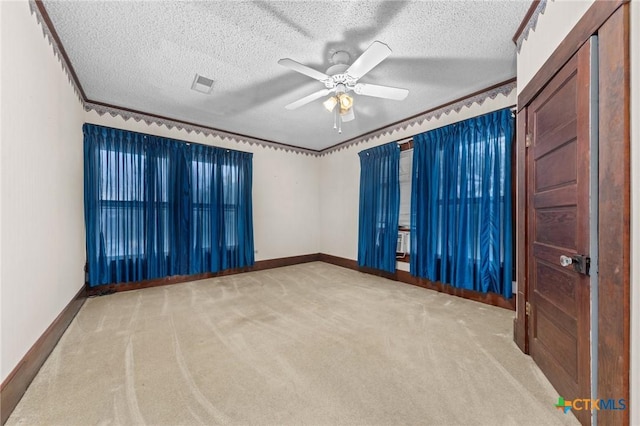 9 S Milam St, Rogers, TX 76569 - carpeted spare room with baseboards, visible vents, ceiling fan, and a textured ceiling