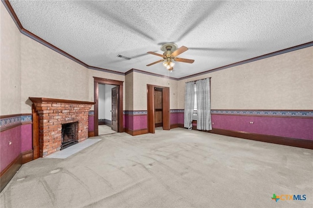 9 S Milam St, Rogers, TX 76569 - unfurnished living room featuring a textured ceiling, visible vents, a fireplace, crown molding, and a ceiling fan