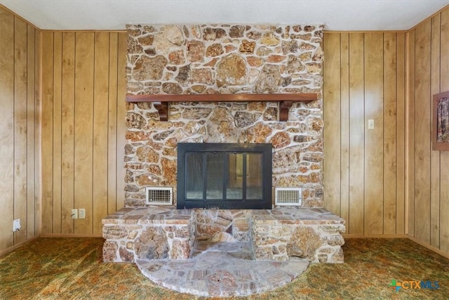 4412 Briar Cliff Rd, Temple, TX 76502 - detailed view of wood walls, baseboards, and a stone fireplace