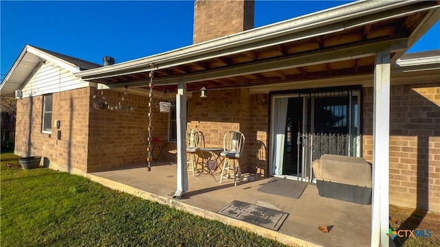 rear view of house with a patio