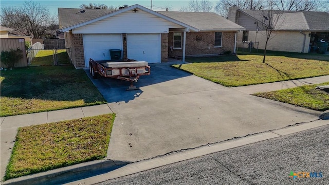 ranch-style home with a garage and a front yard