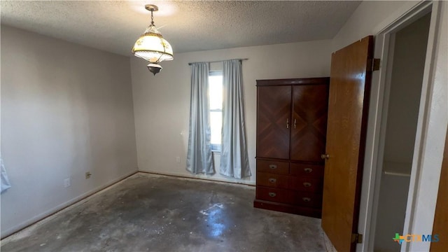 unfurnished bedroom with a textured ceiling