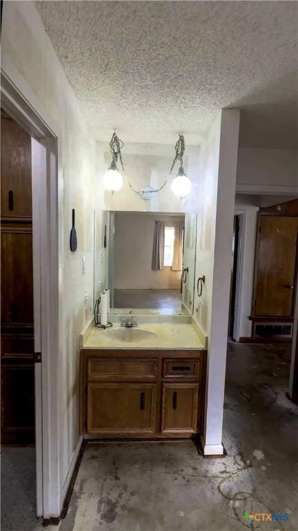 bathroom featuring vanity and a textured ceiling