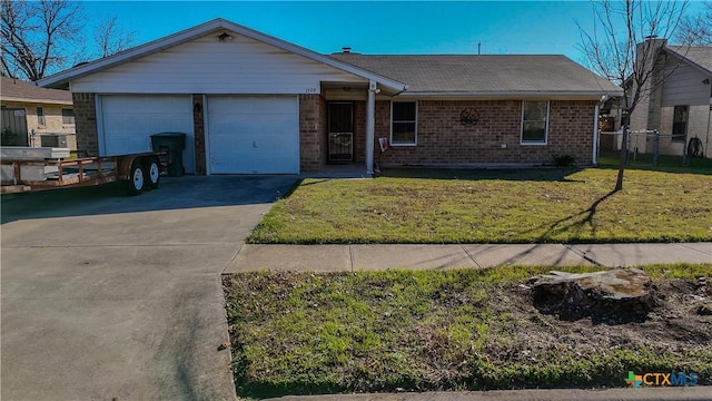 ranch-style home featuring a garage and a front lawn